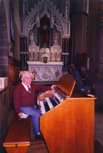 [Old organ console in fron of the Sacred Heart Altar]