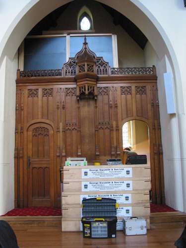 [Organ components in front of shrine panelling]